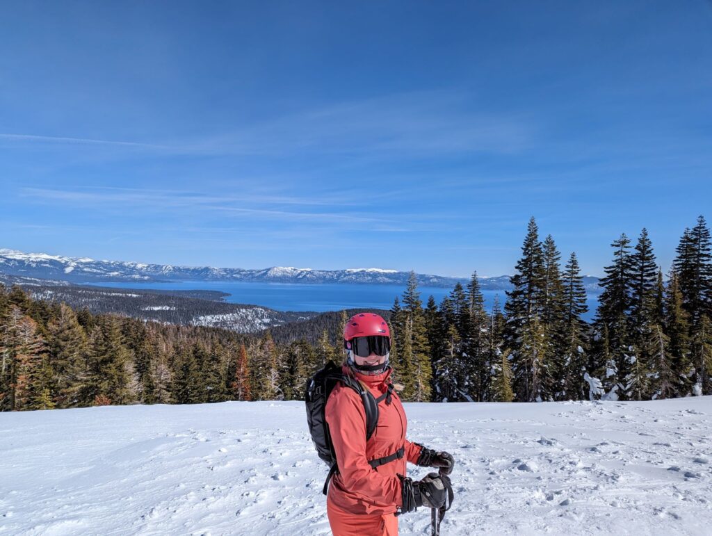 The author in front of a picturesque view of Lake Tahoe