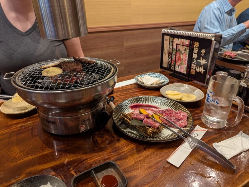 Food cooking on a grill at a Yakiniku restaurant in Tokyo